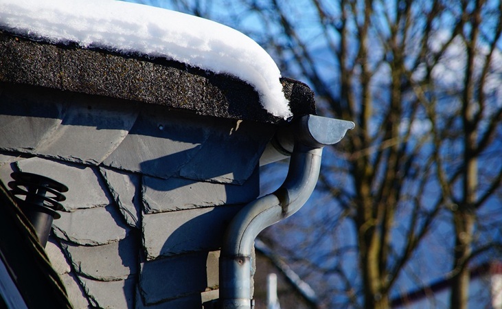 Guttering and downpipe under a roof Guttering and downpipe under a roof