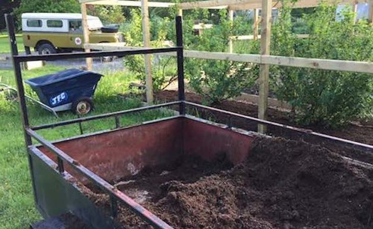 Horse manure in a trailer in the Quickcrop garden
