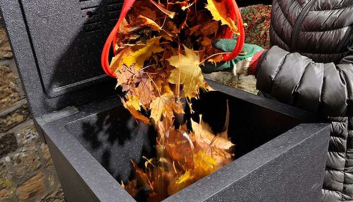 Adding leaves to hotbin compost bin