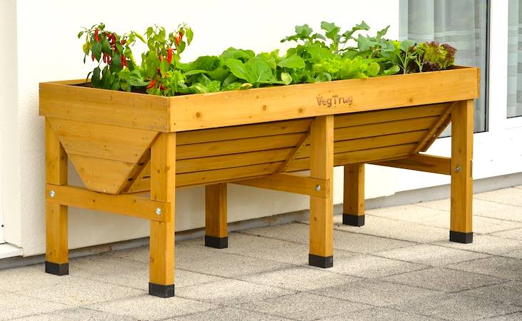 a Vegtrug trough-shaped wooden planter