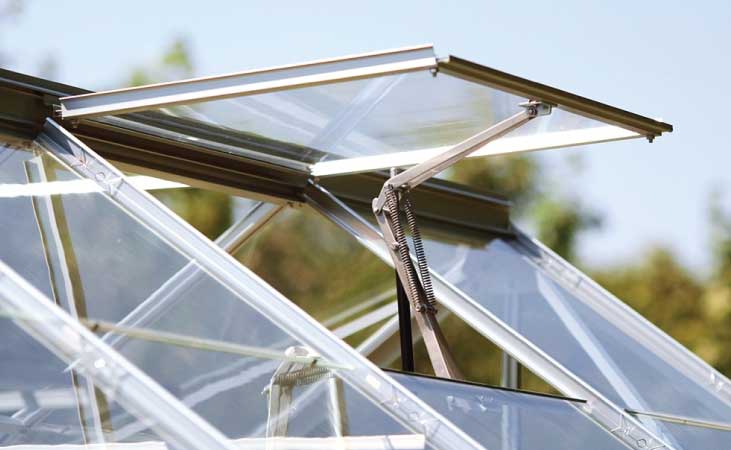 a greenhouse pane opened out to provide ventilation