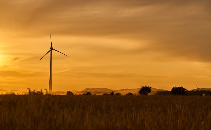 A wind turbine tower at dusk