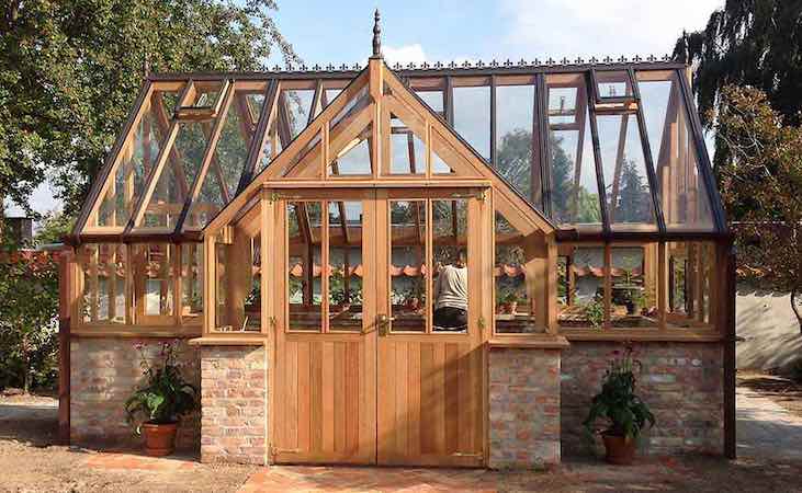 Traditional timber wooden greenhouse